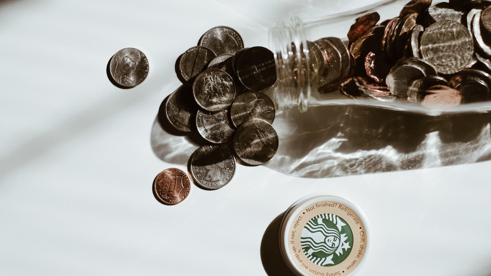 Glass jar filled with coins