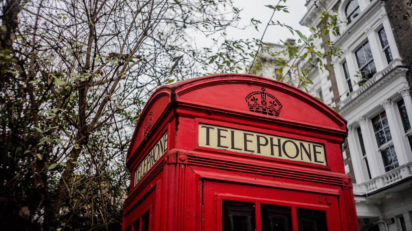Red British telephone box on a street