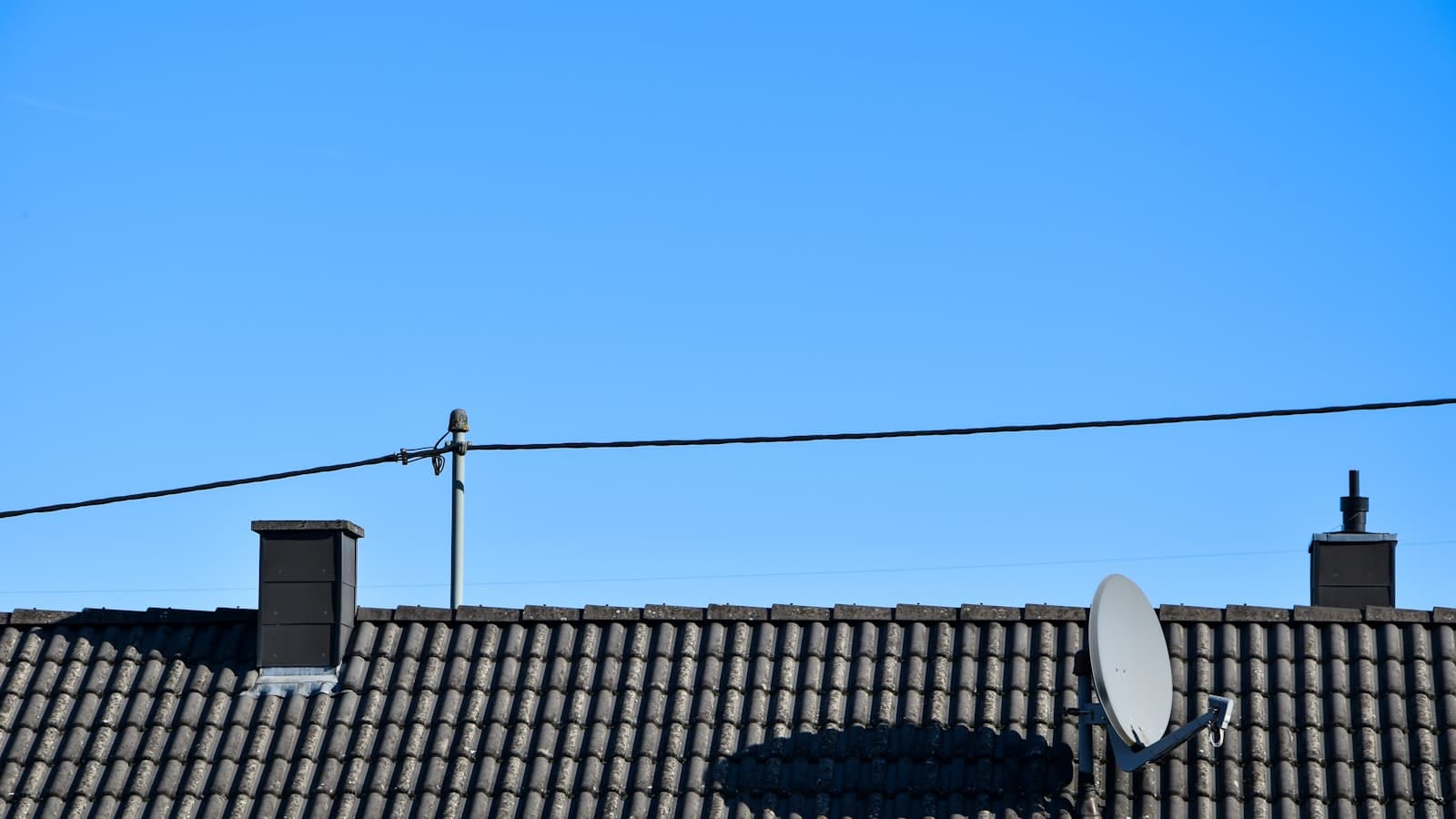 Satellite dish mounted on a rooftop
